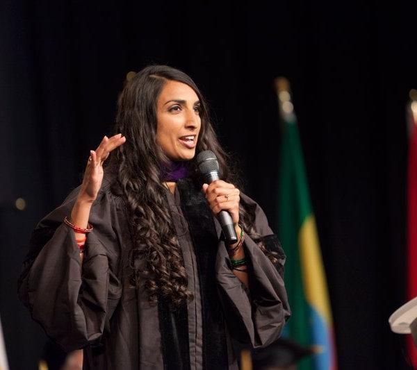 Valarie Kaur speaking with a microphone